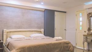 Postel nebo postele na pokoji v ubytování Hotel Ciudad Latin Palace