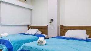 Postel nebo postele na pokoji v ubytování Hotel Ciudad Latin Palace