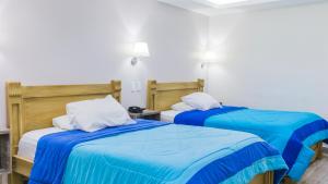 Postel nebo postele na pokoji v ubytování Hotel Ciudad Latin Palace