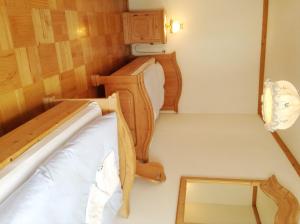 Ein Bett oder Betten in einem Zimmer der Unterkunft Frühstückspension zur Post Reisinger KG St Oswald
