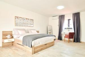 Postel nebo postele na pokoji v ubytování Villa Dolcea