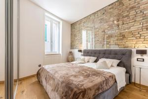 Postel nebo postele na pokoji v ubytování Queen Apartment