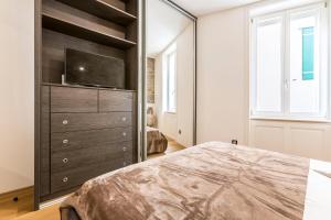 Postel nebo postele na pokoji v ubytování Queen Apartment