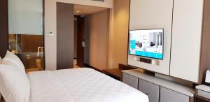 TV a/nebo společenská místnost v ubytování Wyndham Opi Hotel Palembang