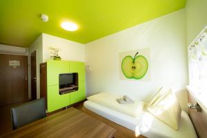 Voodi või voodid majutusasutuse Hotel Greenrooms toas