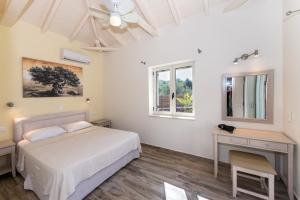 Ένα ή περισσότερα κρεβάτια σε δωμάτιο στο Amoya villas
