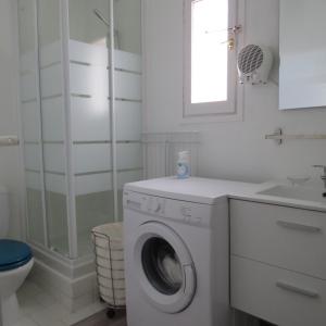 a white bathroom with a washing machine and a sink at appartement 4 pers 50 m plage 4B237 in Le Barcarès