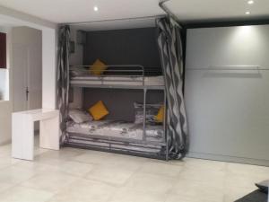 a room with two bunk beds in a room at Cap Negre villa in Six-Fours-les-Plages