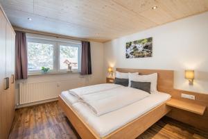 Postel nebo postele na pokoji v ubytování Ferienwohnungen stiLECHt