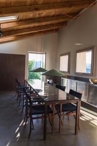 a dining room with a long table and chairs at Villa Fortezza Antique Rooms in Ascoli Piceno