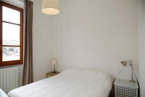 Posteľ alebo postele v izbe v ubytovaní Appartamento Ponticello - HelloElba