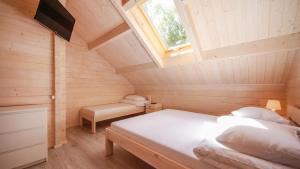 Postel nebo postele na pokoji v ubytování Family-Holiday Spa&Resort + 70 fotografií