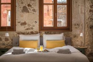 Postel nebo postele na pokoji v ubytování Residenza Vranas Boutique Hotel