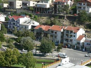 an aerial view of a city with houses and cars at Hotel Leder in Kočani