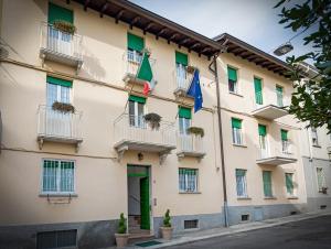 a building with flags in front of it at Albergo Edera in Salsomaggiore Terme