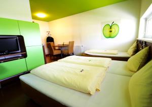 Łóżko lub łóżka w pokoju w obiekcie Hotel Greenrooms