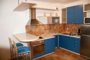 Kuchyňa alebo kuchynka v ubytovaní ROZA Apartment + 2 fotografie