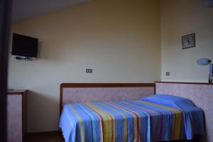 Postel nebo postele na pokoji v ubytování Hotel Martinez