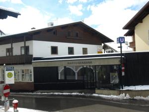 a building with a gate in front of a building at Apart EVA in Serfaus