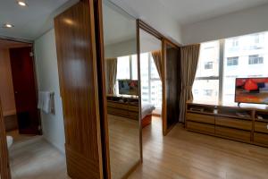 Uma televisão e/ou sistema de entretenimento em Homy Residence