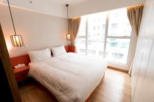Uma cama ou camas num quarto em Homy Residence
