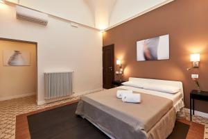 Postel nebo postele na pokoji v ubytování Donna Teresa Guest House