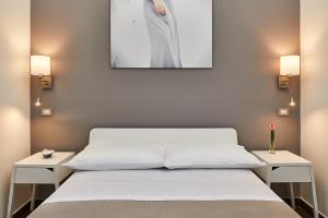 Postel nebo postele na pokoji v ubytování Donna Teresa Guest House