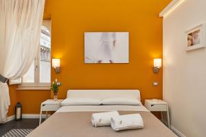 Postel nebo postele na pokoji v ubytování Donna Teresa Guest House