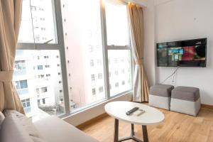 Uma televisão e/ou sistema de entretenimento em Homy Residence