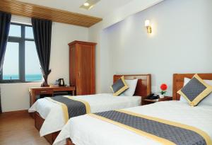Katil atau katil-katil dalam bilik di SEASIDE HOTEL