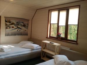Postel nebo postele na pokoji v ubytování Hotel Galushko