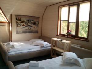 Postel nebo postele na pokoji v ubytování Hotel Galushko