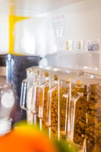 a group of jars of food sitting on a counter at London Town Hotel in London