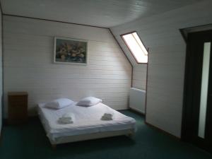 Postel nebo postele na pokoji v ubytování Hotel Galushko