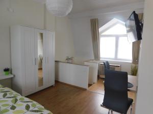 A bed or beds in a room at Mona apartman