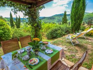 a table with a plate of food on top at Holiday Home La Corte by Interhome in Lucolena in Chianti