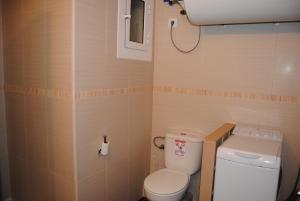 a small bathroom with a toilet and a sink at Legroux - 373 in Llafranc +16 photos