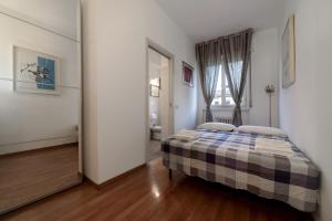 Posteľ alebo postele v izbe v ubytovaní Casa da Suite Classica