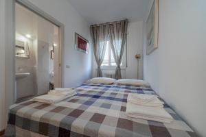 Posteľ alebo postele v izbe v ubytovaní Casa da Suite Classica