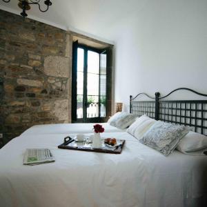 Ένα ή περισσότερα κρεβάτια σε δωμάτιο στο Hotel Arco de Mazarelos