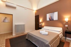 Postel nebo postele na pokoji v ubytování Donna Teresa Guest House