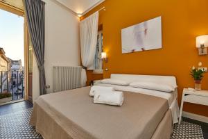 Postel nebo postele na pokoji v ubytování Donna Teresa Guest House