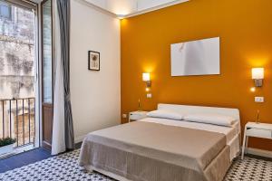 Postel nebo postele na pokoji v ubytování Donna Teresa Guest House
