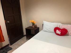 Postel nebo postele na pokoji v ubytování Edem Tourist Inn Malapascua