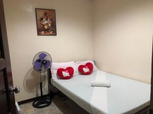 Postel nebo postele na pokoji v ubytování Edem Tourist Inn Malapascua