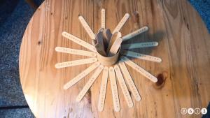 a wooden table with a clock made out of sticks at Xinshe Hotel - Hsinchu in Hsinchu City