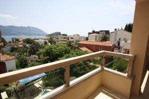 a balcony with a view of a city at The Old Town Terrace Apartments in Budva