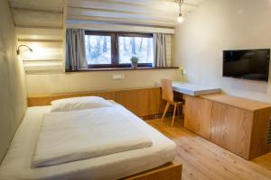 Postel nebo postele na pokoji v ubytování Koliba u Cerneho Medveda + 25 fotografií