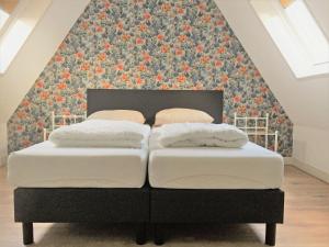 Кровать или кровати в номере Holiday Home Wiringherlant-10 by Interhome