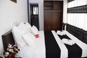 Postel nebo postele na pokoji v ubytování Hotel Agape